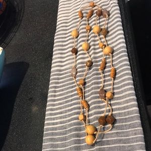Natural wood beaded necklace on knotted cord